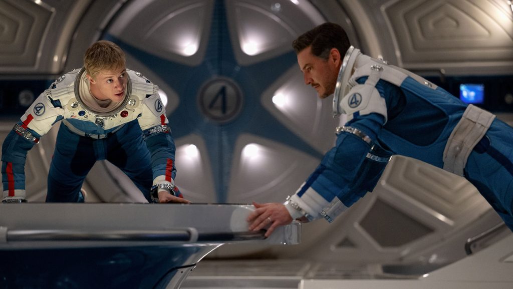 (L-R) Joseph Quinn as Johnny Storm/Human Torch and Pedro Pascal as Reed Richards/Mister Fantastic in The Fantastic Four: First Steps