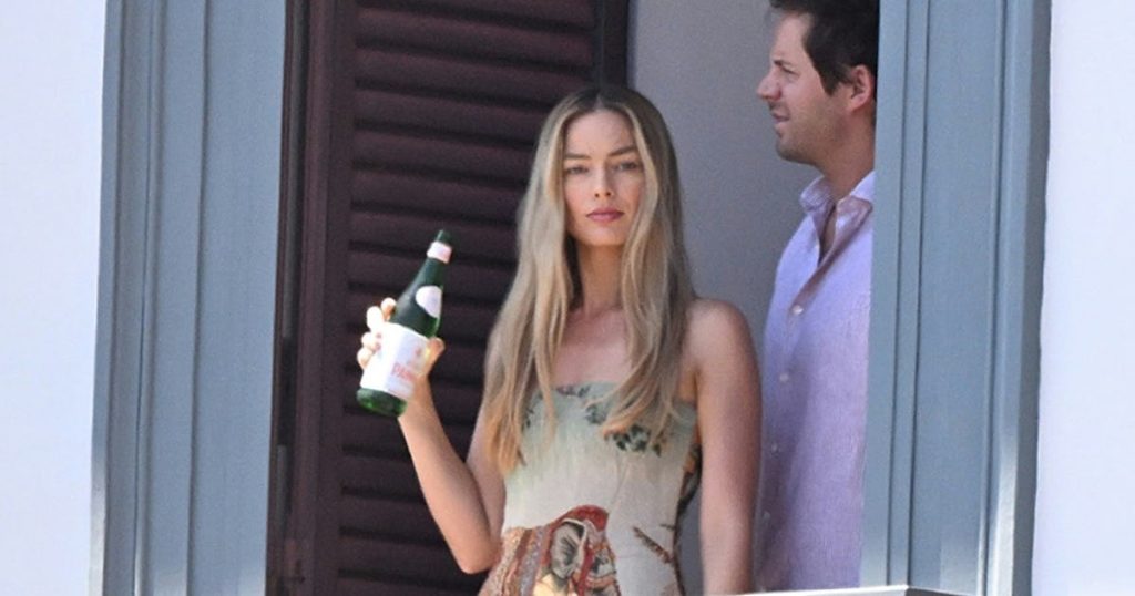 Margot Robbie Rewears Her Favorite Vacation Mini Dress in Naples, Italy