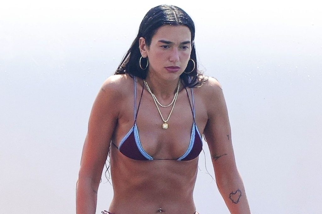 Dua Lipa Puts a Twist on the Tiny Bikini While Doing Yoga Atop a Paddleboard in Ibiza