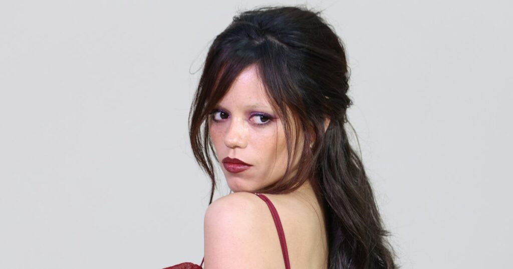 Jenna Ortega Makes the Case for Off-Season Sheer in See-Through Burgundy Look
