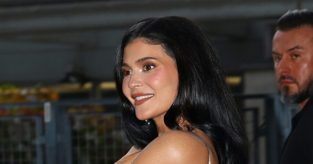 Kylie Jenner Wears Plunging Party Dress to Watch Kendall Walk the Runway in Paris