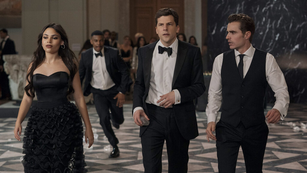 Box Office: ‘Now You See Me 3’ Sprints to Surprise $75.5M Global Win as ‘Running Man’ Chokes Ariana Greenblatt as June, Jesse Eisenberg as Daniel Atlas, and Dave Franco as Jack Wilder in Now You See Me: Now You Don’t.