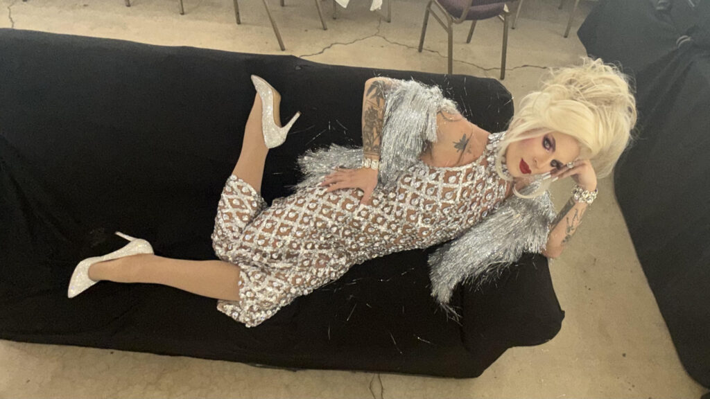 Katya Zamolodchikova Is the Snob the Culture Needs Katya Zamolodchikova reclining on a couch in a silver dress