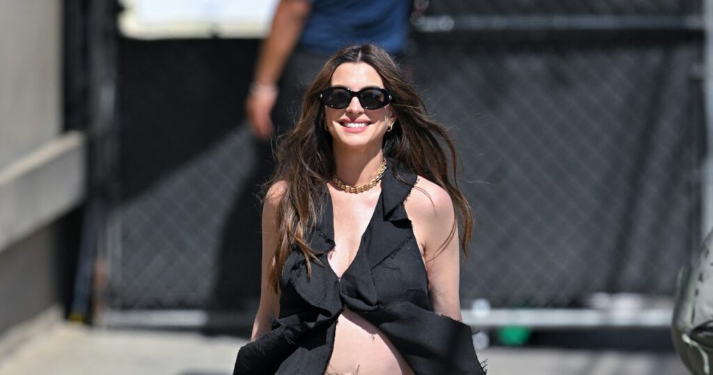 Anne Hathaway Proves Her Baby Bump Is Very Much Real With a Tattered Halter Top Anne Hathaway Proves Her Baby Bump Is Very Much Real With a Tattered Halter Top