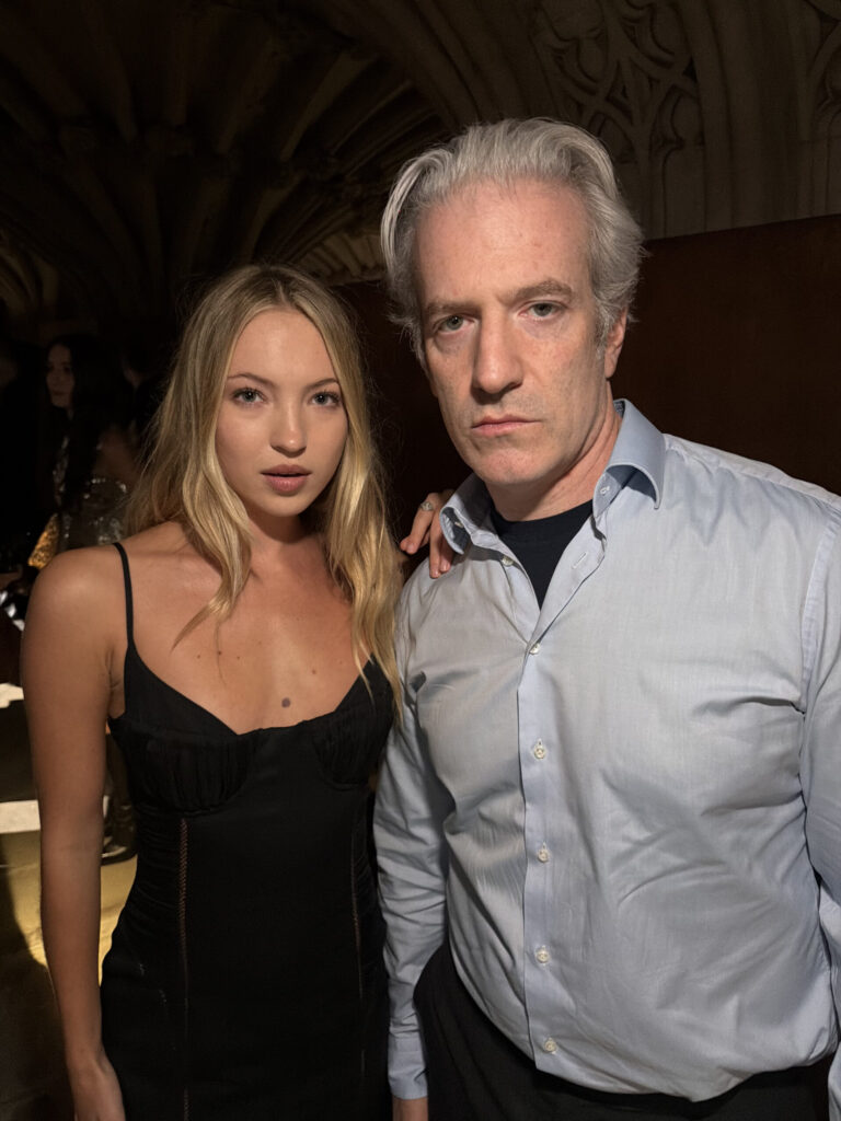 Lila Moss and Mel Ottenberg pose for a photo at the McQueen SS27 show.